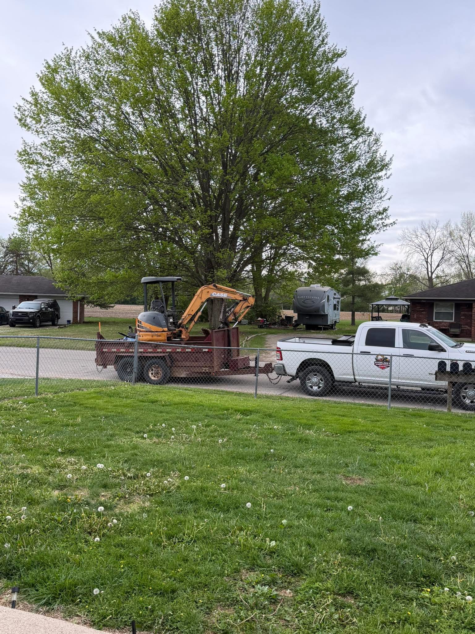 Excavator working on a residential demolition site