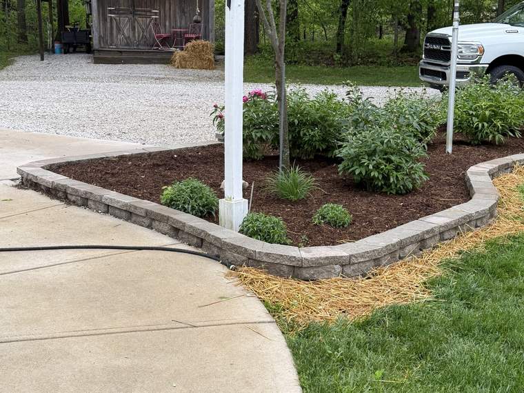 Block wall and planting bed built along a front walk
