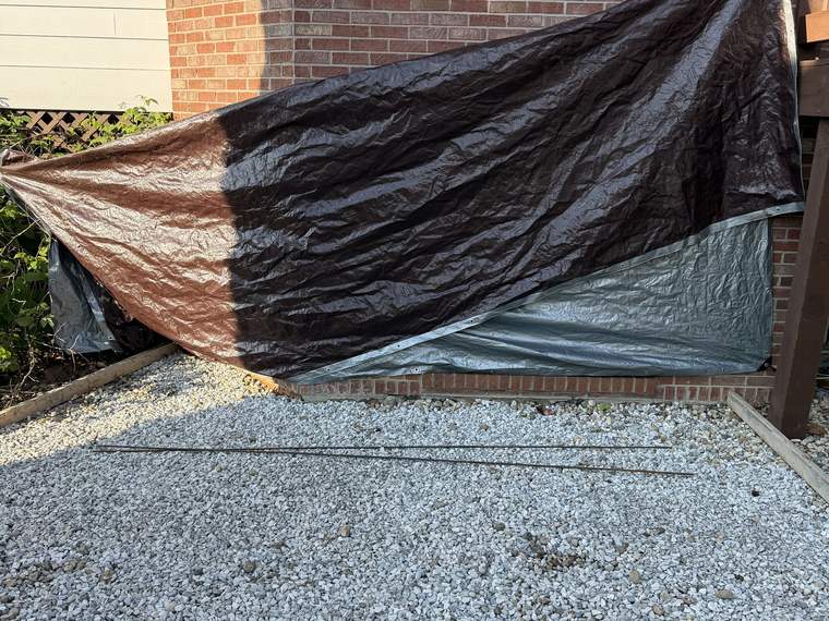 Compacted stone base prepared and covered before a concrete pour