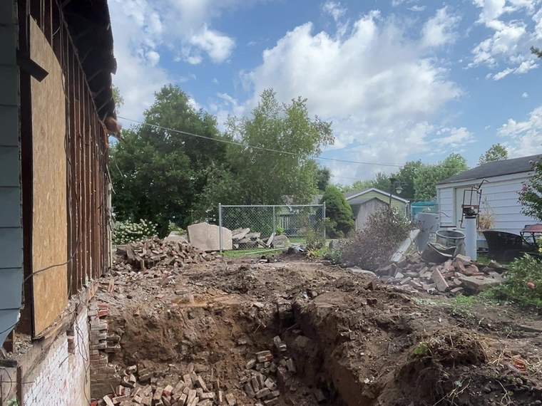 Open excavation at a demolition site with the debris cleared away