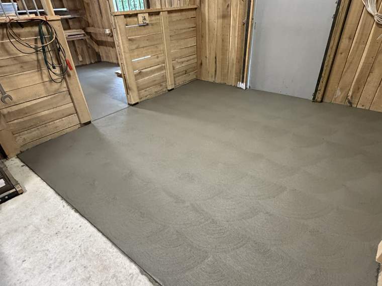 New concrete floor poured inside a garage